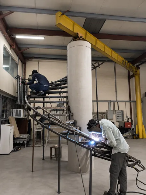 Custom steel staircase fabricated by Finesse