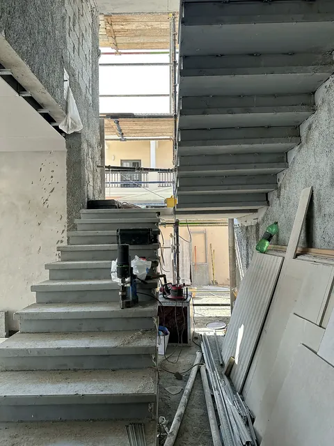 Custom steel staircase fabricated by Finesse