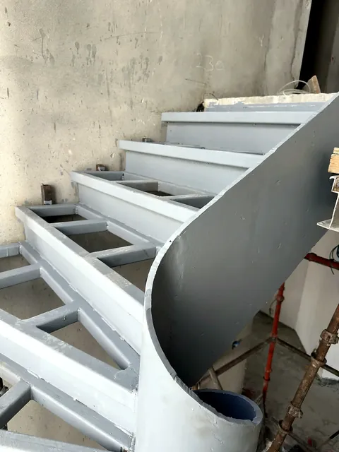 Custom steel staircase fabricated by Finesse
